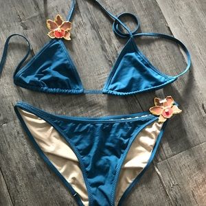 Teal Victoria’s Secret two piece swimsuit.
